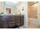 Bathroom with shower/tub and double vanity with granite countertops at 1292 Blue Island Dr, Clermont, FL 34714