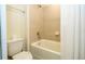 The tiled bathtub and toilet provide a clean, functional space at 1292 Blue Island Dr, Clermont, FL 34714