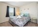 Comfortable bedroom features cozy decor, natural light from the window, and modern accents at 1292 Blue Island Dr, Clermont, FL 34714