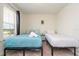 Bedroom featuring two twin beds, natural light, and carpeted floors at 1292 Blue Island Dr, Clermont, FL 34714