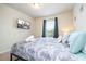 This cozy bedroom has a TV and window for natural light, creating a welcoming space at 1292 Blue Island Dr, Clermont, FL 34714