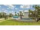 Windsor Cay Resort entrance featuring landscaping, a fountain, and a welcoming tower at 1292 Blue Island Dr, Clermont, FL 34714