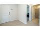 Entryway leading to bedroom and bathroom; neutral tones and tiled floor at 1292 Blue Island Dr, Clermont, FL 34714