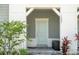 Charming front entrance with stylish door and landscaped surroundings at 1292 Blue Island Dr, Clermont, FL 34714