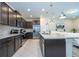 Spacious kitchen with stainless steel appliances, granite countertops, and center island with bar seating at 1292 Blue Island Dr, Clermont, FL 34714