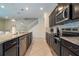 Spacious kitchen with stainless steel appliances, granite countertops, and a view of the staircase at 1292 Blue Island Dr, Clermont, FL 34714