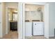 Laundry area with new white front-load washer and dryer units at 1292 Blue Island Dr, Clermont, FL 34714