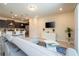 Bright living room with modern furnishings adjacent to the kitchen, creating an open layout at 1292 Blue Island Dr, Clermont, FL 34714