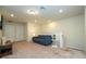 Inviting living room featuring a blue sofa, modern side table, and neutral decor at 1292 Blue Island Dr, Clermont, FL 34714