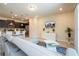 Bright living room with modern furnishings adjacent to the kitchen, creating an open layout at 1292 Blue Island Dr, Clermont, FL 34714