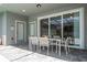Covered patio with an outdoor dining set, perfect for entertaining at 1292 Blue Island Dr, Clermont, FL 34714