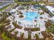 Overhead view of Windsor Cay's luxurious pool area with seating and lush landscaping at 1292 Blue Island Dr, Clermont, FL 34714