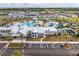 Resort-style pool area with a kiddie splash zone, ample seating, palm trees, and convenient parking at 1292 Blue Island Dr, Clermont, FL 34714