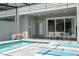 Private outdoor living space with pool, lounge chairs, and outdoor dining area at 1292 Blue Island Dr, Clermont, FL 34714