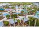 Aerial view of the community resort-style pool area with lush landscaping and water slides at 1292 Blue Island Dr, Clermont, FL 34714