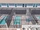 Screened-in private pool area with lounge chairs and brick-paved patio for outdoor enjoyment at 1292 Blue Island Dr, Clermont, FL 34714