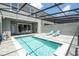Private pool area featuring outdoor dining and lounging space at 1292 Blue Island Dr, Clermont, FL 34714