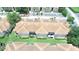 Aerial view of condo buildings, manicured lawns, and parking areas at 13207 Villa Vista Dr # 205, Orlando, FL 32824