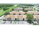 Sprawling condo community with lush green spaces and a tranquil pond at 13207 Villa Vista Dr # 205, Orlando, FL 32824