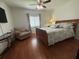 Bright bedroom with hardwood floors, offering comfort and relaxation in a serene setting at 13207 Villa Vista Dr # 205, Orlando, FL 32824