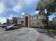 Inviting condo with tiled roof, arched entryway, and parking available in well maintained complex at 13207 Villa Vista Dr # 205, Orlando, FL 32824