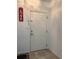 Bright white front door with modern hardware and a decorative 'Love' sign at 13207 Villa Vista Dr # 205, Orlando, FL 32824