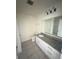 Bathroom featuring a granite countertop, white cabinets, and tiled floors at 1557 Venice Ln, Davenport, FL 33896