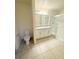 Bathroom features a double sink vanity, granite countertop, and a glass-enclosed shower at 1557 Venice Ln, Davenport, FL 33896
