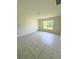 Bright room with tiled flooring, neutral walls, and a window with a view of the outdoors at 1557 Venice Ln, Davenport, FL 33896