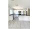 Modern kitchen with stainless steel appliances, granite countertops, and white cabinetry at 1557 Venice Ln, Davenport, FL 33896
