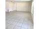 Spacious open-concept living room with tile flooring and bright natural light at 1557 Venice Ln, Davenport, FL 33896