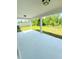 This backyard features a concrete patio and green grass at 1557 Venice Ln, Davenport, FL 33896