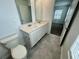 Bathroom features double sinks, large mirrors, and updated fixtures at 15579 Water Spring Blvd, Winter Garden, FL 34787