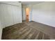 Bedroom with plush carpeting, double closet doors, and neutral decor for a serene retreat at 15579 Water Spring Blvd, Winter Garden, FL 34787