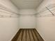 This closet features wire shelving and neutral carpet at 15579 Water Spring Blvd, Winter Garden, FL 34787
