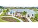 Aerial view of a community center featuring lush landscaping and a welcoming entrance at 15579 Water Spring Blvd, Winter Garden, FL 34787