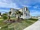 Beautiful exterior of a two-story home with well-kept lawn and sidewalk on a sunny day at 15579 Water Spring Blvd, Winter Garden, FL 34787