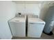 This laundry room has a new washer, dryer, and hot water heater at 15579 Water Spring Blvd, Winter Garden, FL 34787