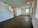 Spacious living room with natural light, features tile flooring and staircase access at 15579 Water Spring Blvd, Winter Garden, FL 34787