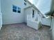 Private outdoor patio featuring stylish brick pavers, ideal for relaxing and entertaining at 15579 Water Spring Blvd, Winter Garden, FL 34787