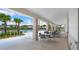 Covered outdoor seating area by a large pool, perfect for relaxation and social gatherings at 15579 Water Spring Blvd, Winter Garden, FL 34787