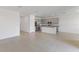 Expansive living area showcasing an open floor plan leading into a modern kitchen at 1580 Gardiner St, Haines City, FL 33844