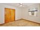 Neutral bedroom featuring carpet, closet, and window at 1607 Lindale Ave, Eustis, FL 32726