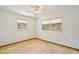 Cozy bedroom with natural light from the two windows at 1607 Lindale Ave, Eustis, FL 32726