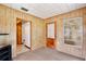 Versatile room with wood paneling, carpet, and a window, suitable for various uses at 1607 Lindale Ave, Eustis, FL 32726