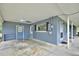 This carport offers an entrance with a horseshoe above the door and a view through the sunroom window at 1607 Lindale Ave, Eustis, FL 32726