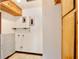 Utility room with shelving, hookups, and additional storage space at 1607 Lindale Ave, Eustis, FL 32726