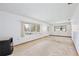 Bright living room with large windows and a tiled floor at 1607 Lindale Ave, Eustis, FL 32726