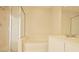 Bathroom featuring a separate tub, glass shower, vanity with a large mirror at 1730 Spicebush Ct, Orlando, FL 32828