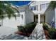 Townhome with a private entrance, manicured bushes and a one car garage at 1730 Spicebush Ct, Orlando, FL 32828